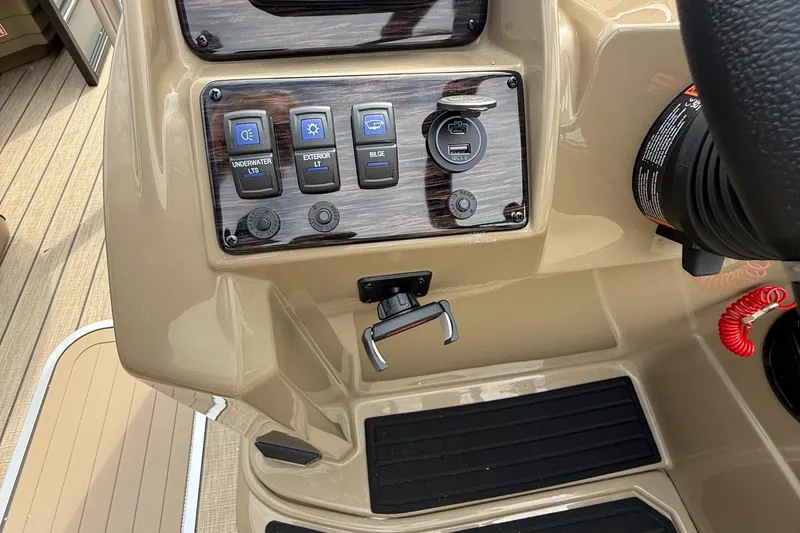 Slide: The Image of Control panel of 2026 Sylvan X-1 CLZ DH boat with switches and USB port. - 12