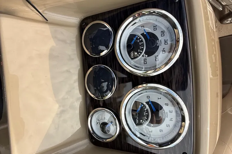 Slide: The Image of Dashboard of 2026 Sylvan X-1 CLZ DH with chrome-rimmed gauges and beige interior. - 13