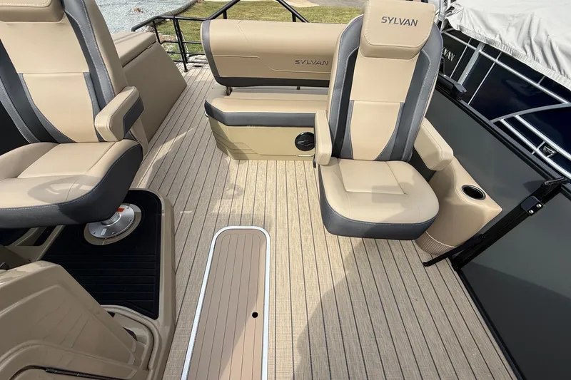 Slide: The Image of Luxurious interior of 2026 Sylvan X-1 CLZ DH boat with beige seating and wood flooring. - 17