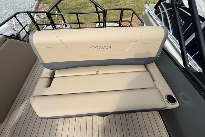 Slide: The Image of 2026 Sylvan X-1 CLZ DH boat seat with beige upholstery and cup holder. - 19