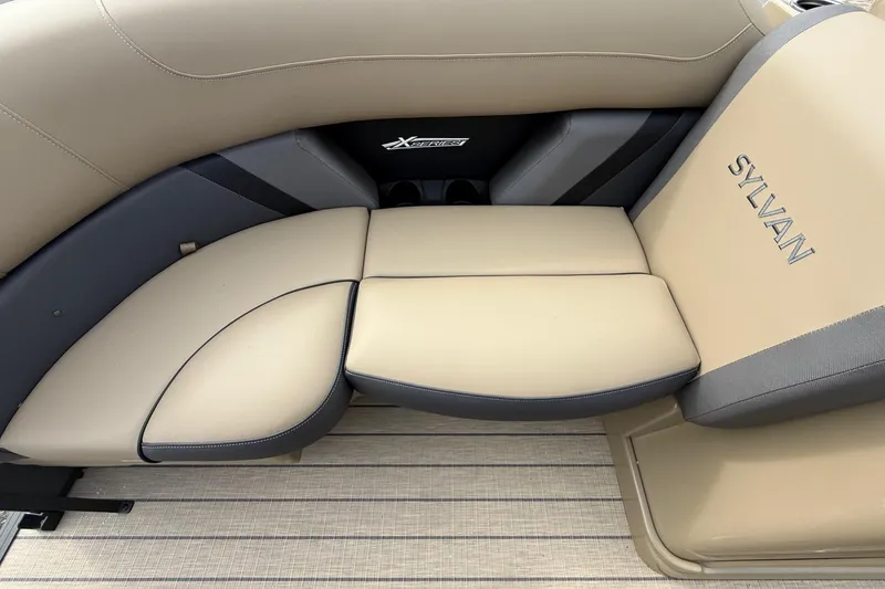 Slide: The Image of Luxurious seating in 2026 Sylvan X-1 CLZ DH boat, featuring beige upholstery and sleek design. - 23