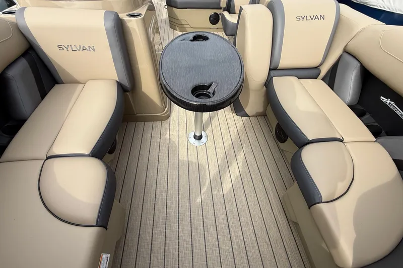 Slide: The Image of Luxurious interior of 2026 Sylvan X-1 CLZ DH boat with beige seating and table. - 25