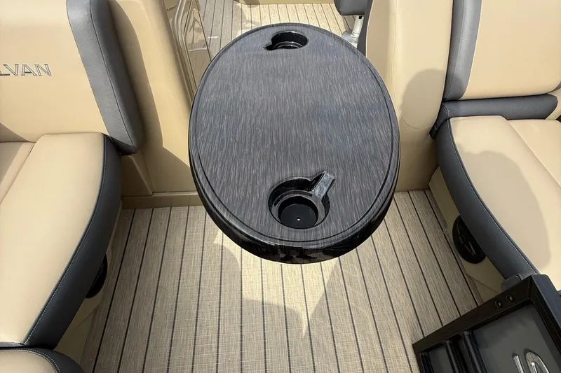 Slide: The Image of Interior of 2026 Sylvan X-1 CLZ DH boat with sleek table and beige seating. - 26