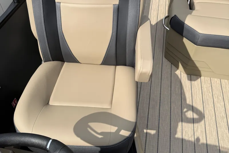 Slide: The Image of Beige and black boat seat on Sylvan X-1 CLZ DH, 2026 model, with striped flooring. - 28