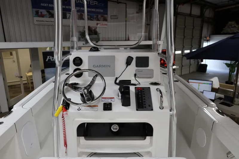 Slide: The Image of 2026 Parker 180 Coastal boat dashboard with Garmin navigation system in showroom. - 13