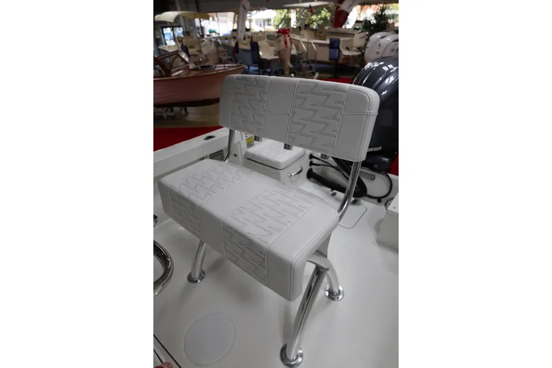 Slide: The Image of 2026 Parker 180 Coastal boat seat with sleek white upholstery and sturdy metal frame. - 14