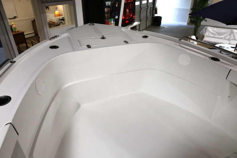 Slide: The Image of 2026 Parker 180 Coastal boat interior, showcasing spacious white deck and seating area. - 15