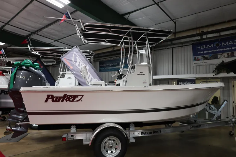 The Image of 2026 Parker 180 Coastal boat displayed indoors on a trailer. - 6