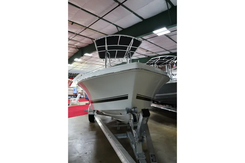 Slide: The Image of 2026 Parker 180 Coastal boat on trailer in indoor showroom. - 8