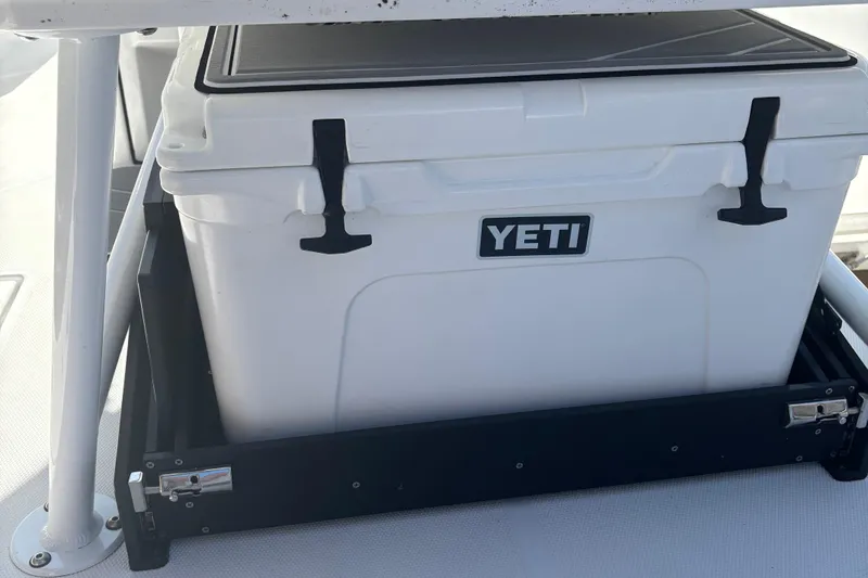 Slide: The Image of YETI cooler on 2022 Blackfin 252 CC boat, secured in a black frame. - 14