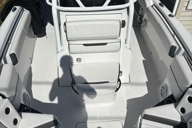 Slide: The Image of 2022 Blackfin 252 CC boat interior with white seating and modern design. - 22