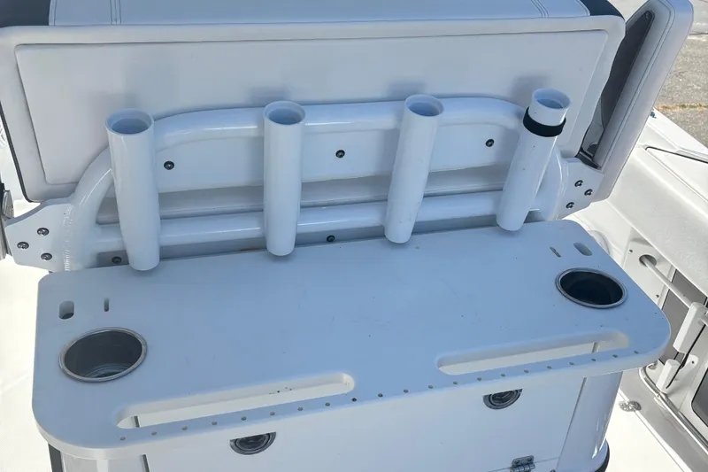 Slide: The Image of 2022 Blackfin 252 CC boat with rod holders and cup holders on deck. - 8