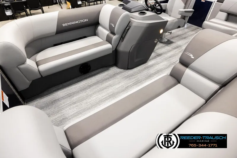 Slide: The Image of 2026 Bennington 188 SLJSE pontoon boat interior with plush seating and modern console. - 10