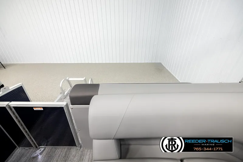 Slide: The Image of 2026 Bennington 188 SLJSE boat interior with gray seating, displayed at Reeder-Trausch Marine. - 15