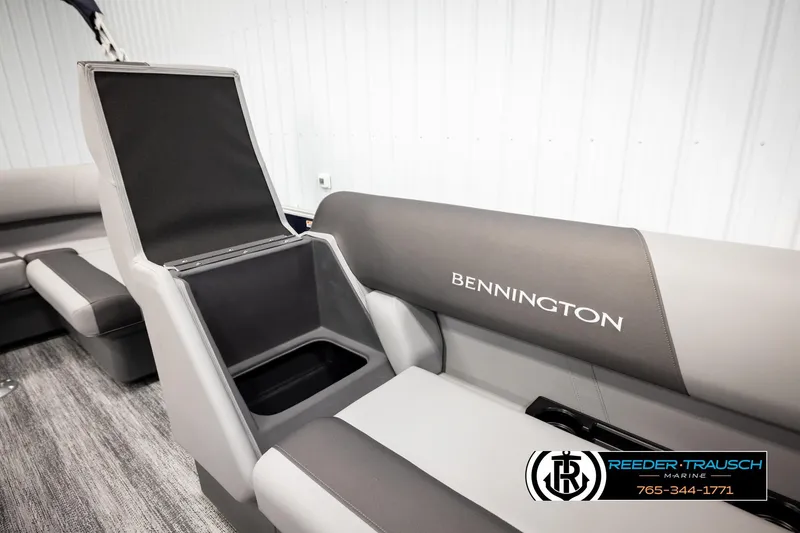 Slide: The Image of 2026 Bennington 188 SLJSE boat interior with open storage compartment and seating. - 21
