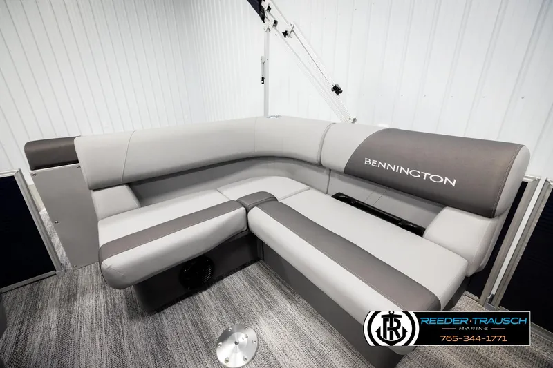 Slide: The Image of 2026 Bennington 188 SLJSE boat interior with gray seating and logo. - 22