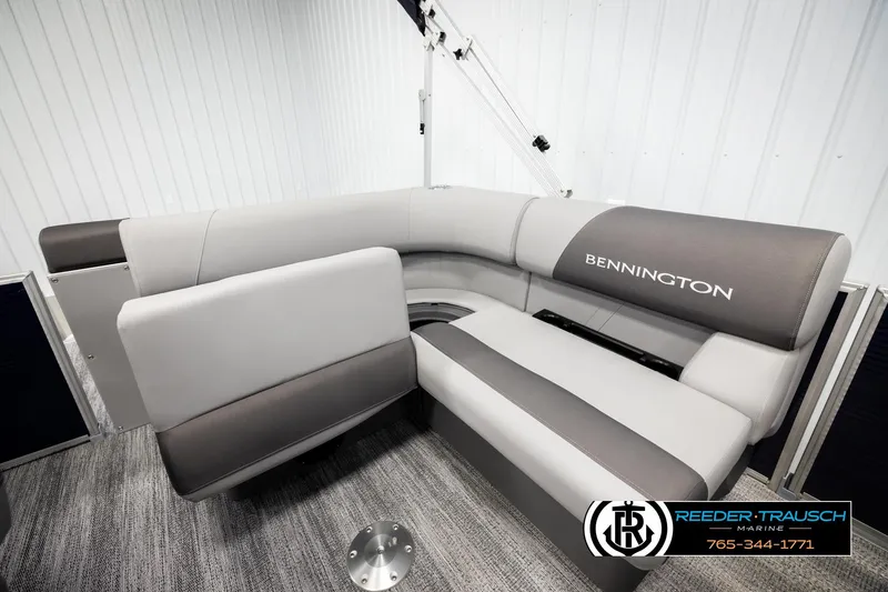 Slide: The Image of 2026 Bennington 188 SLJSE boat interior with gray seating and logo. - 24