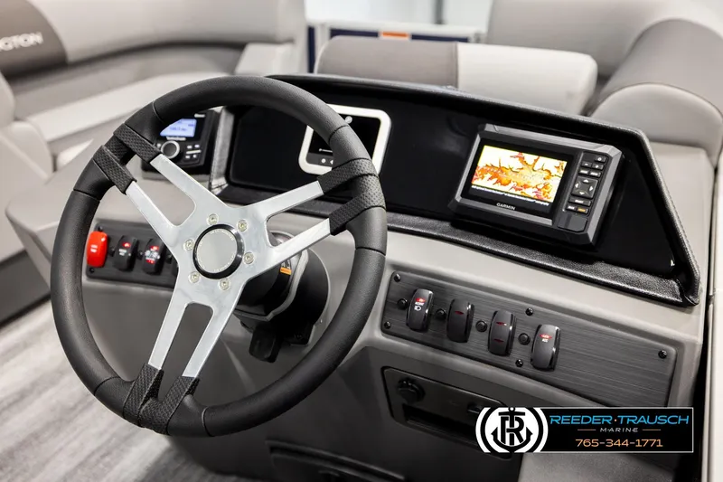 Slide: The Image of Steering console of 2026 Bennington 188 SLJSE with navigation display and controls. - 26