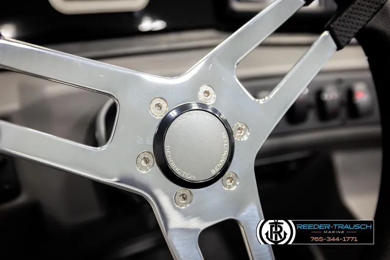 Slide: The Image of Steering wheel of 2026 Bennington 188 SLJSE boat, featuring sleek metallic design. - 28
