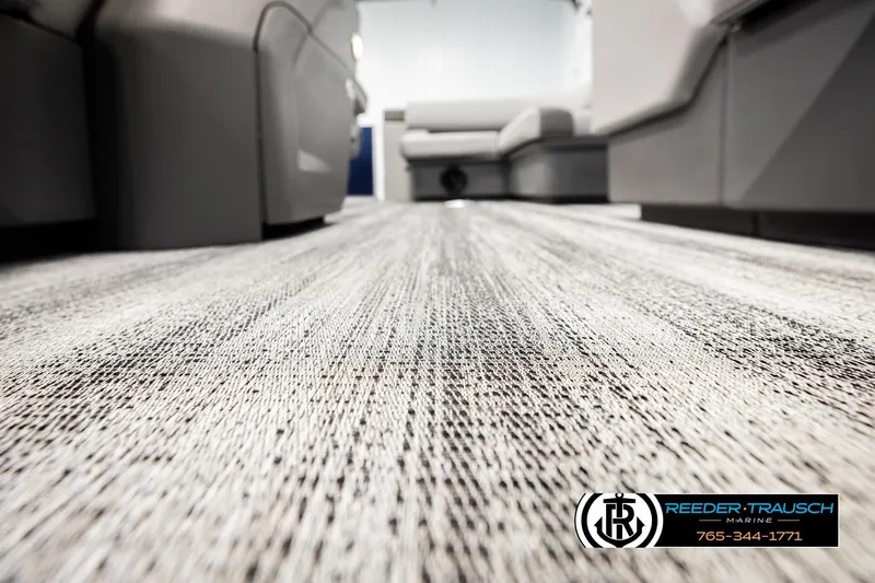 Slide: The Image of 2026 Bennington 188 SLJSE interior flooring with modern design, featuring Reeder-Trausch Marine branding. - 42