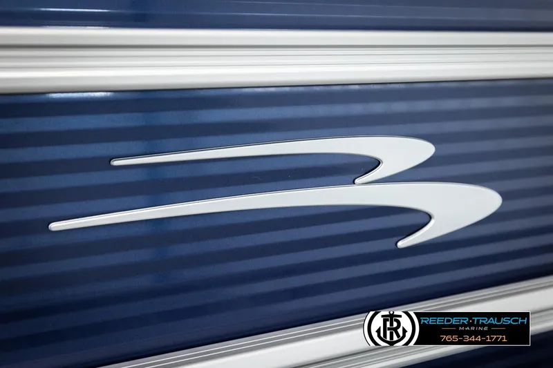 Slide: The Image of 2026 Bennington 188 SLJSE boat logo on blue striped background. - 43