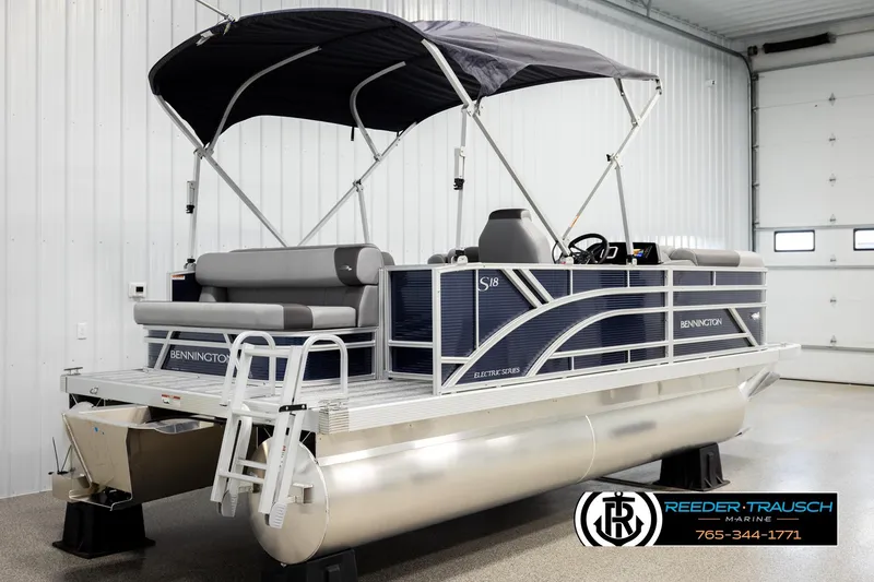 Slide: The Image of 2026 Bennington 188 SLJSE pontoon boat with canopy in a showroom. - 6
