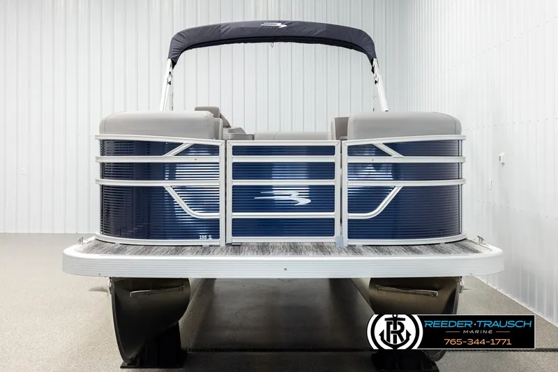 Slide: The Image of 2026 Bennington 188 SLJSE pontoon boat in showroom, front view. - 8