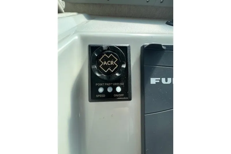 Slide: The Image of Control panel on 2023 Parker 2820 XLD Sport Cabin boat dashboard. - 12