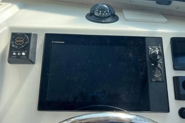 Slide: The Image of Control panel of 2023 Parker 2820 XLD Sport Cabin boat with navigation equipment. - 14