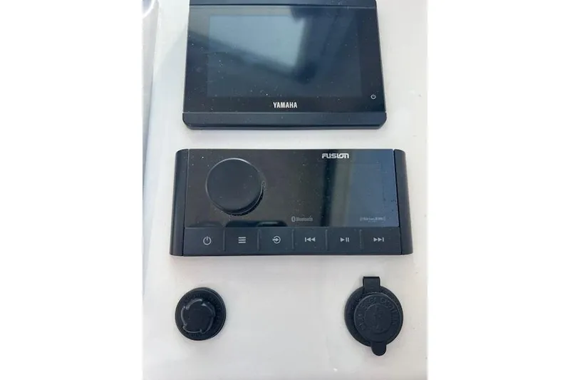 Slide: The Image of Yamaha and Fusion marine electronics on 2023 Parker 2820 XLD Sport Cabin dashboard. - 15
