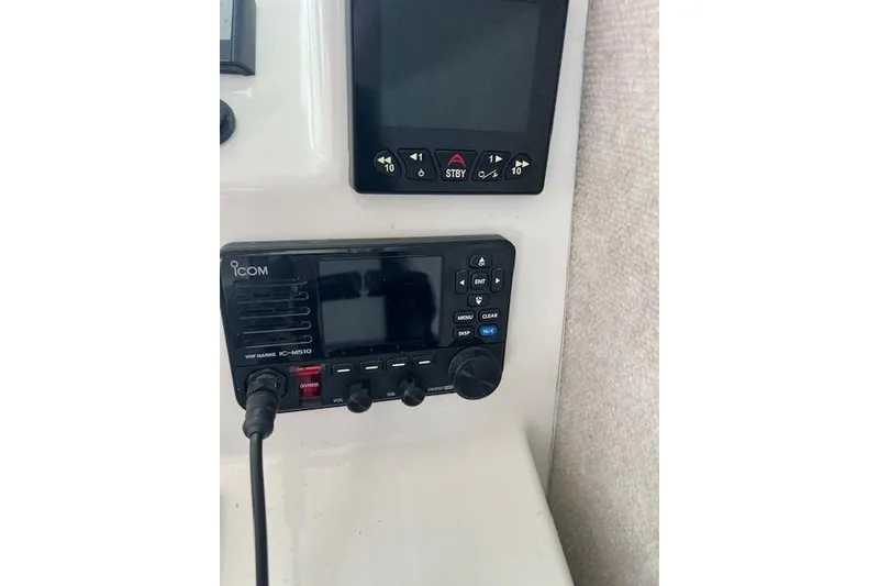 Slide: The Image of Control panel of 2023 Parker 2820 XLD Sport Cabin with Icom VHF marine radio. - 16