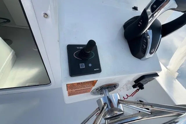 Slide: The Image of Control panel of 2023 Parker 2820 XLD Sport Cabin boat with joystick and throttle. - 23