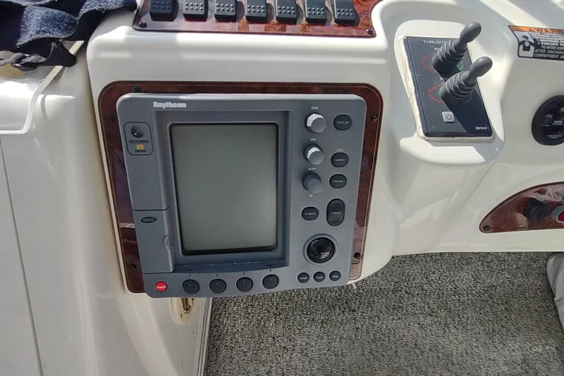 Slide: The Image of Control panel of a 2001 Maxum 4600 SCB yacht with Raytheon navigation system. - 14