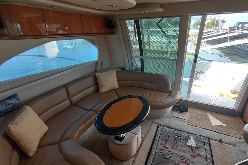 Slide: The Image of Interior of 2001 Maxum 4600 SCB yacht with leather seating and oval table. - 22
