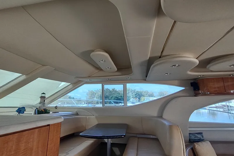 Slide: The Image of Interior of 2001 Maxum 4600 SCB yacht with elegant seating and panoramic windows. - 24