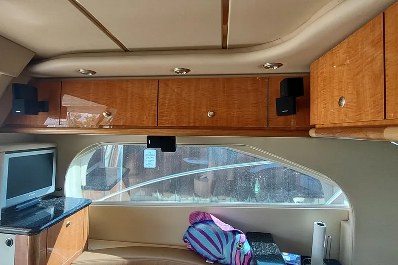 Slide: The Image of Interior of 2001 Maxum 4600 SCB yacht with wood cabinets and TV. - 27