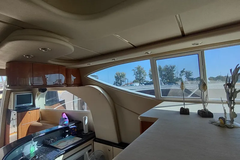 Slide: The Image of Interior of 2001 Maxum 4600 SCB yacht with modern design and large windows. - 30