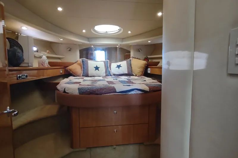 Slide: The Image of Luxurious cabin interior of 2001 Maxum 4600 SCB yacht with cozy bed and ambient lighting. - 4