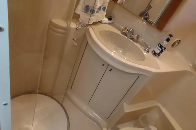 Slide: The Image of Bathroom interior of 2001 Maxum 4600 SCB yacht with sink and shower. - 43