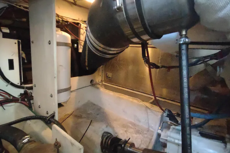 Slide: The Image of Engine room of 2001 Maxum 4600 SCB yacht, showing mechanical components and wiring. - 47