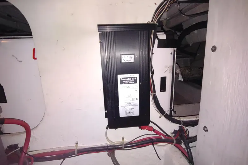 Slide: The Image of Electrical panel inside 2001 Maxum 4600 SCB boat, featuring wiring and components. - 49