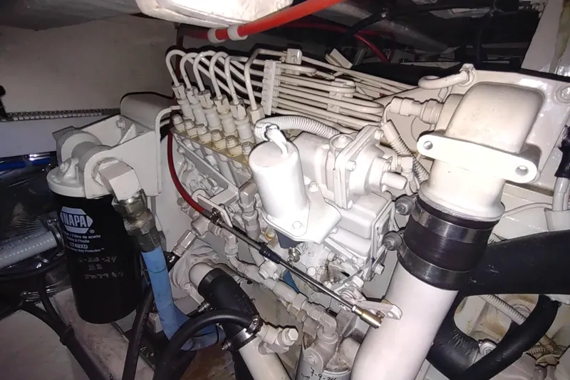 Slide: The Image of Engine compartment of a 2001 Maxum 4600 SCB yacht, showcasing mechanical components. - 52