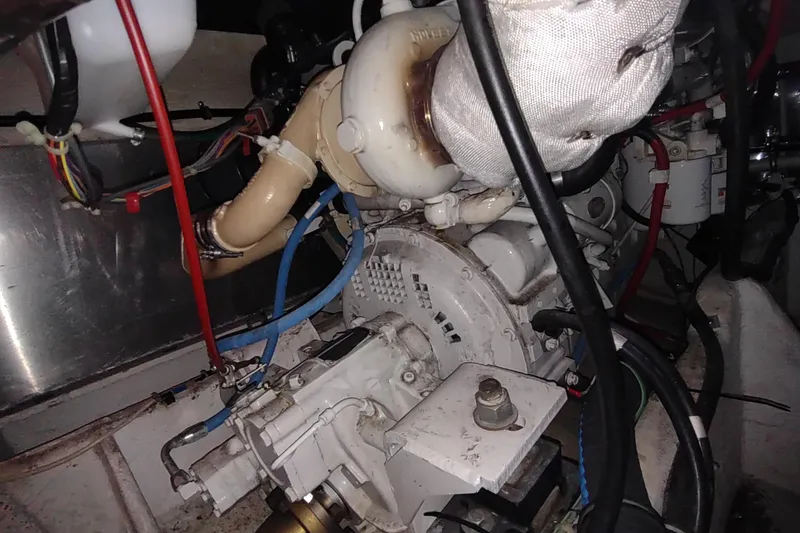 Slide: The Image of Engine compartment of a 2001 Maxum 4600 SCB boat, showing mechanical components and wiring. - 53