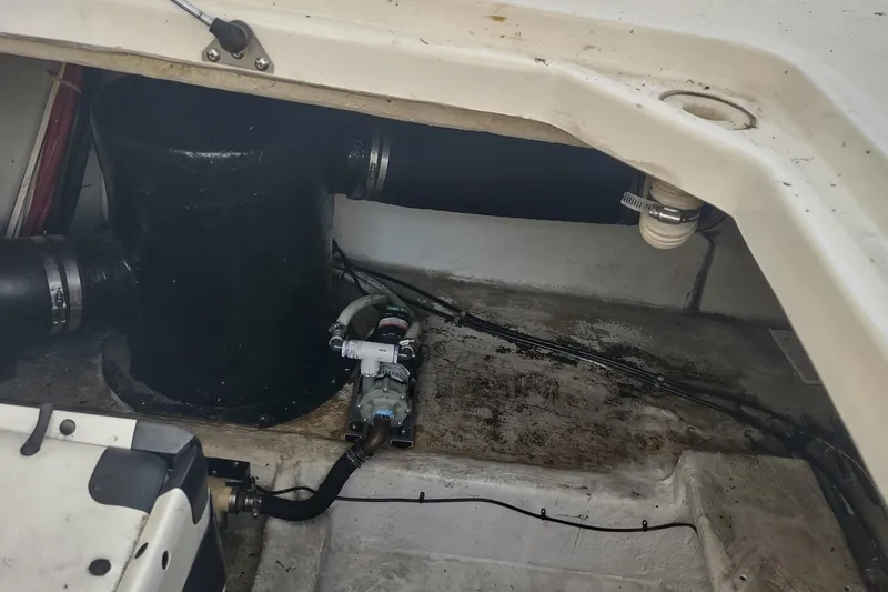 Slide: The Image of Bilge area of a 2001 Maxum 4600 SCB boat, showing plumbing and wiring components. - 54