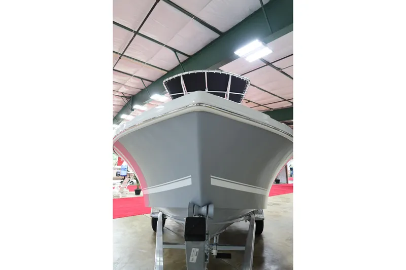 Slide: The Image of 2026 Parker 180 Coastal boat displayed indoors on a trailer. - 8