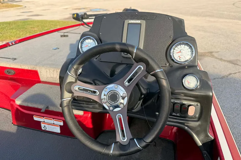 Slide: The Image of Steering console of a 2018 Nitro Z17 boat with gauges and controls. - 2