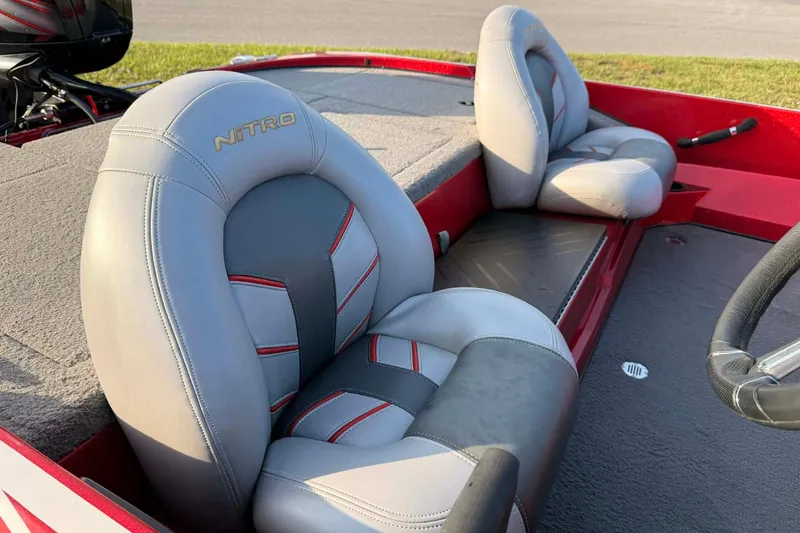 Slide: The Image of 2018 Nitro Z17 boat seats with gray and red accents, showcasing interior design. - 3