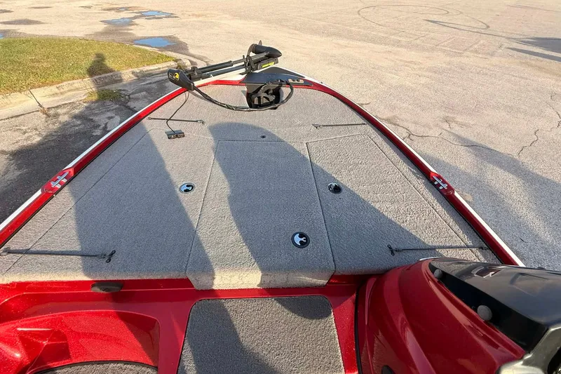 Slide: The Image of 2018 Nitro Z17 boat deck with red trim and fishing equipment. - 5
