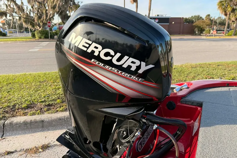 Slide: The Image of Mercury FourStroke engine on a 2018 Nitro Z17 boat, parked outdoors. - 7