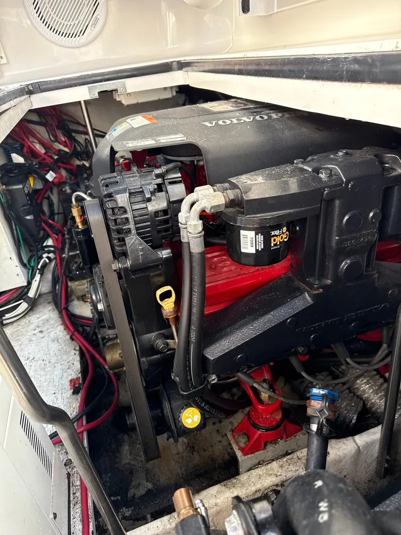 Slide: The Image of Engine compartment of a 2004 Four 328 Vista boat, featuring a Volvo engine. - 10